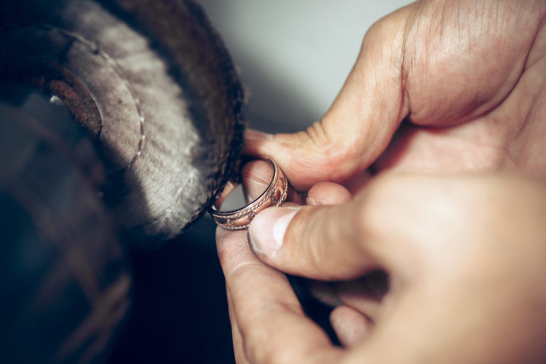 Different goldsmiths tools on the jewelry workplace. Jeweler at work in jewelry